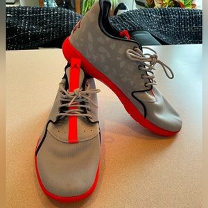 Jordan Air men’s size 9 shoe. Grey and Bright/highlighter orange/red